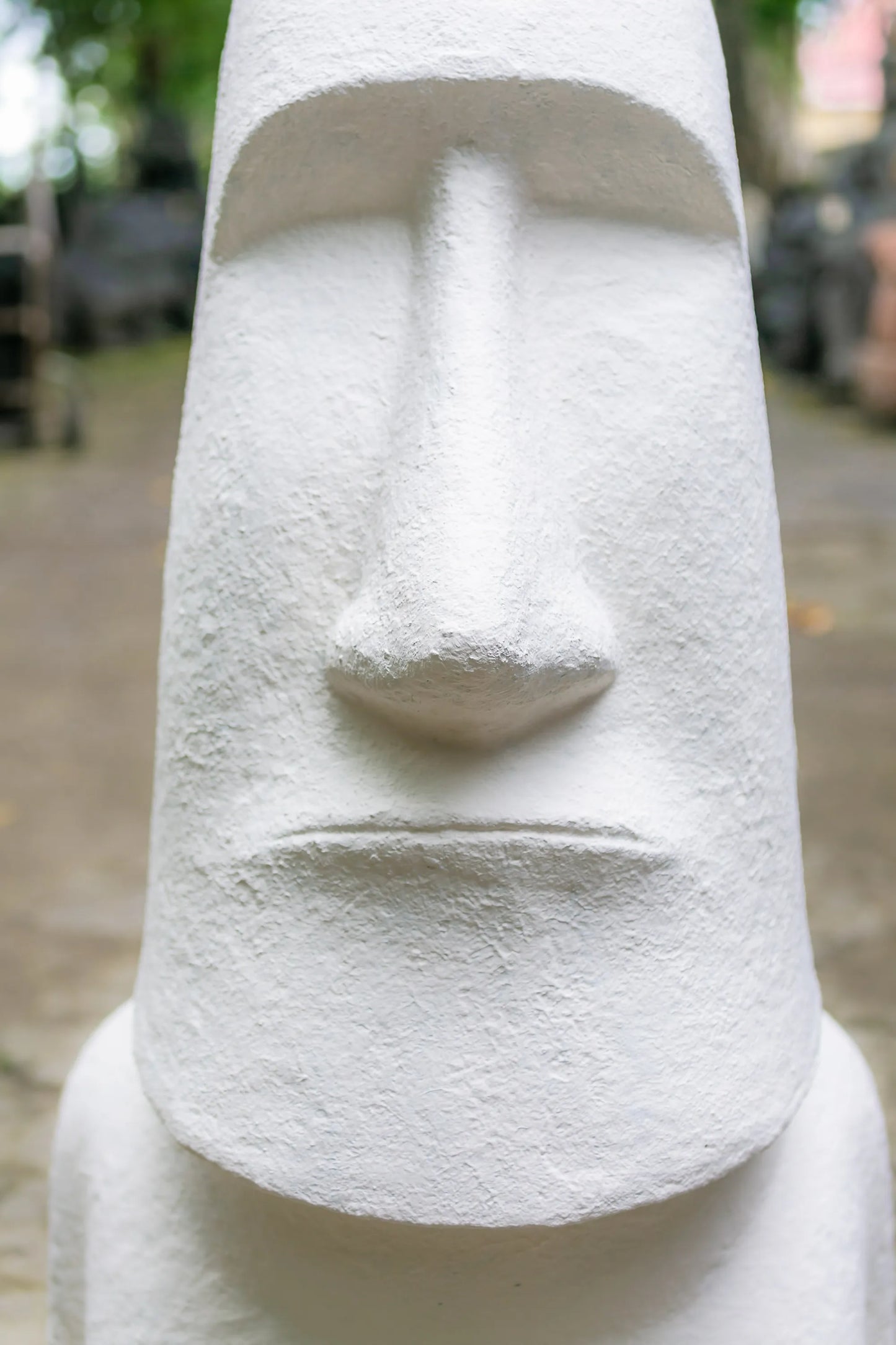 Best Moai Easter Island Head sculpture, crafted from white concrete and fiber. Dimensions: 2 ft 3 in L x 1 ft 8 in W x 5 ft H. Perfect for outdoor settings, shop online now