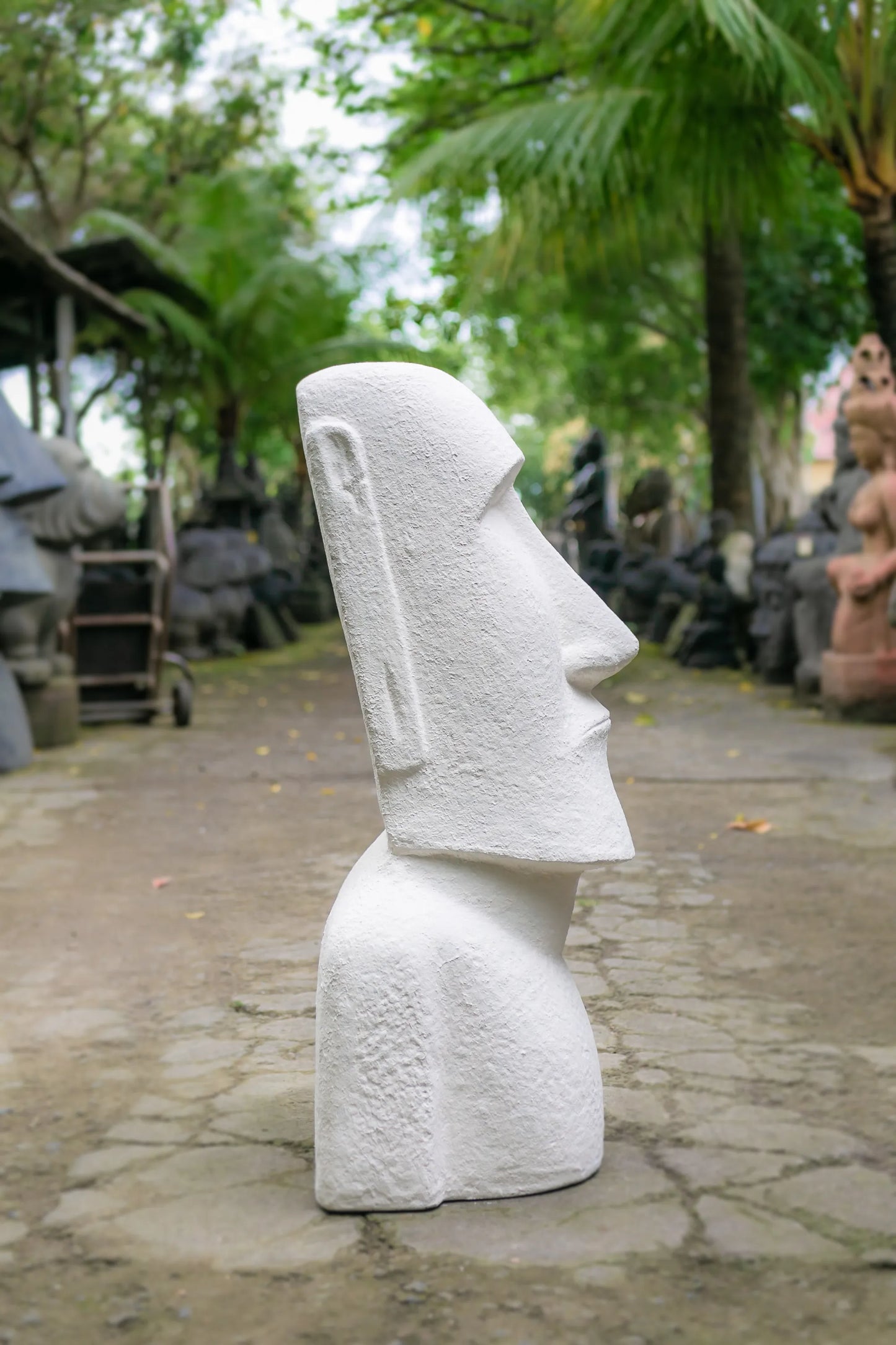 Online shopping for the stunning Moai Easter Island Head, 5 ft tall and made from white concrete and fiber. Ideal for outdoor decor. Buy the best today.